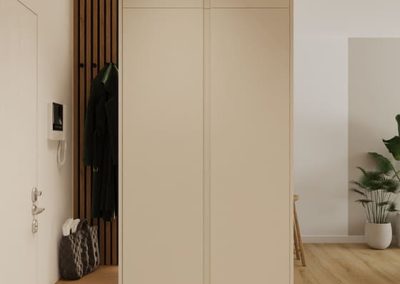 Minimalistyczne wejście z zabudową zaprojektowaną przez projektanta wnętrz.