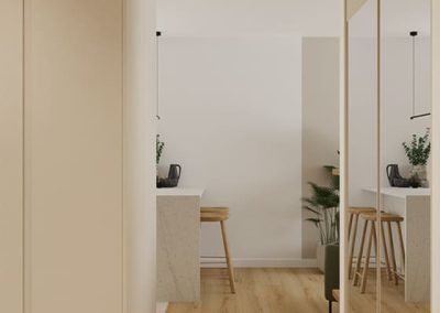 Jasne wejście z zabudową i lustrami w mieszkaniu pod klucz.